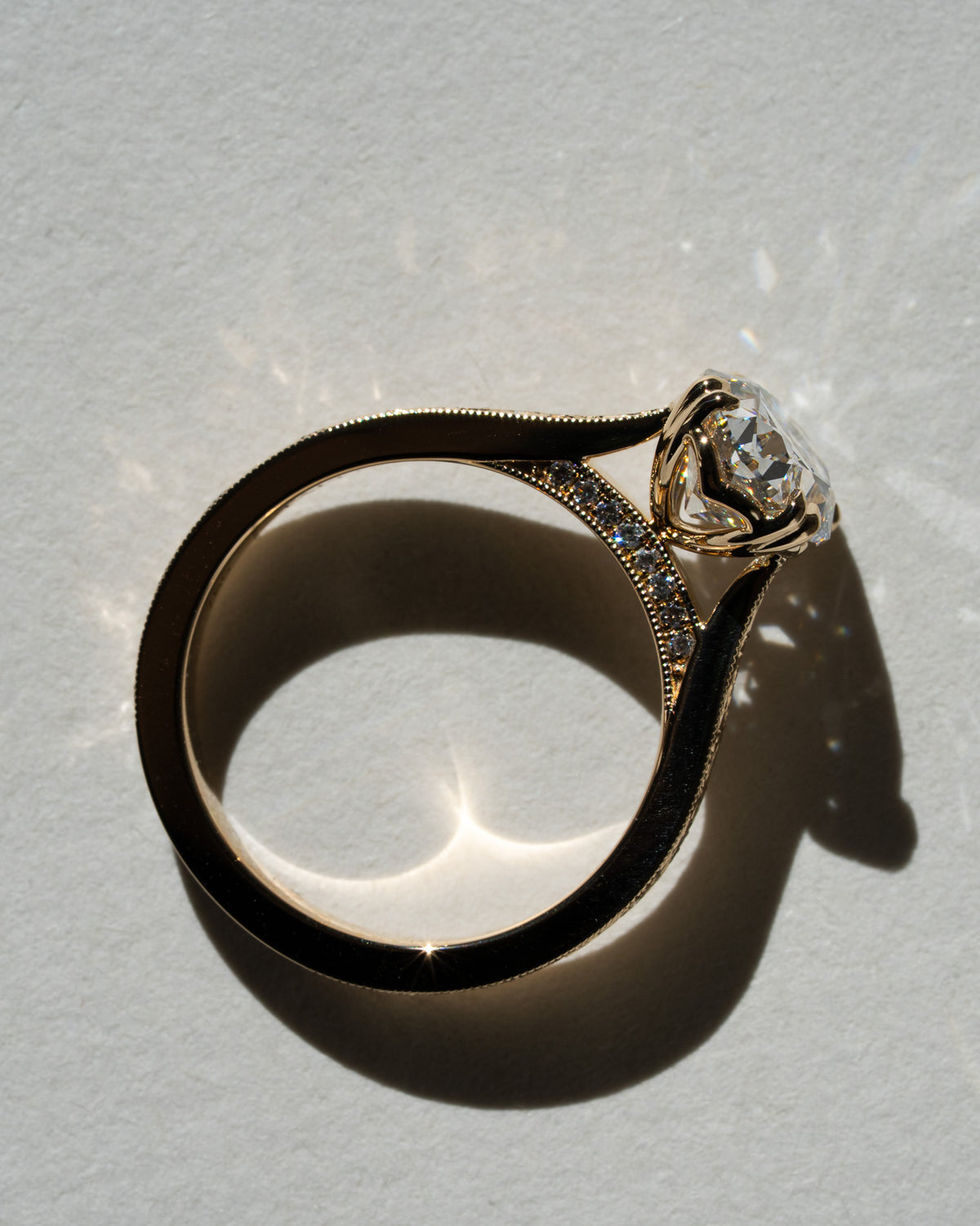 Old mine oval with hand-engraved scroll band