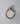 Side view of marquise diamond engagement ring showing cathedral setting and pavΓ© diamond band in yellow gold