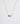 Pear-shaped emerald and diamond necklace on a gold chain.