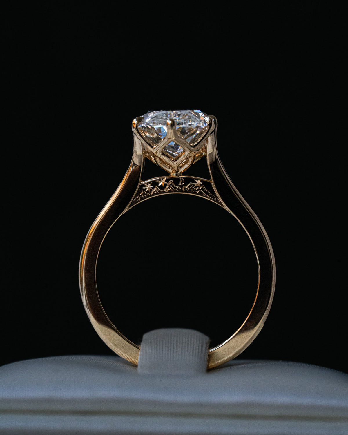 Oval diamond with hidden mountain engraving