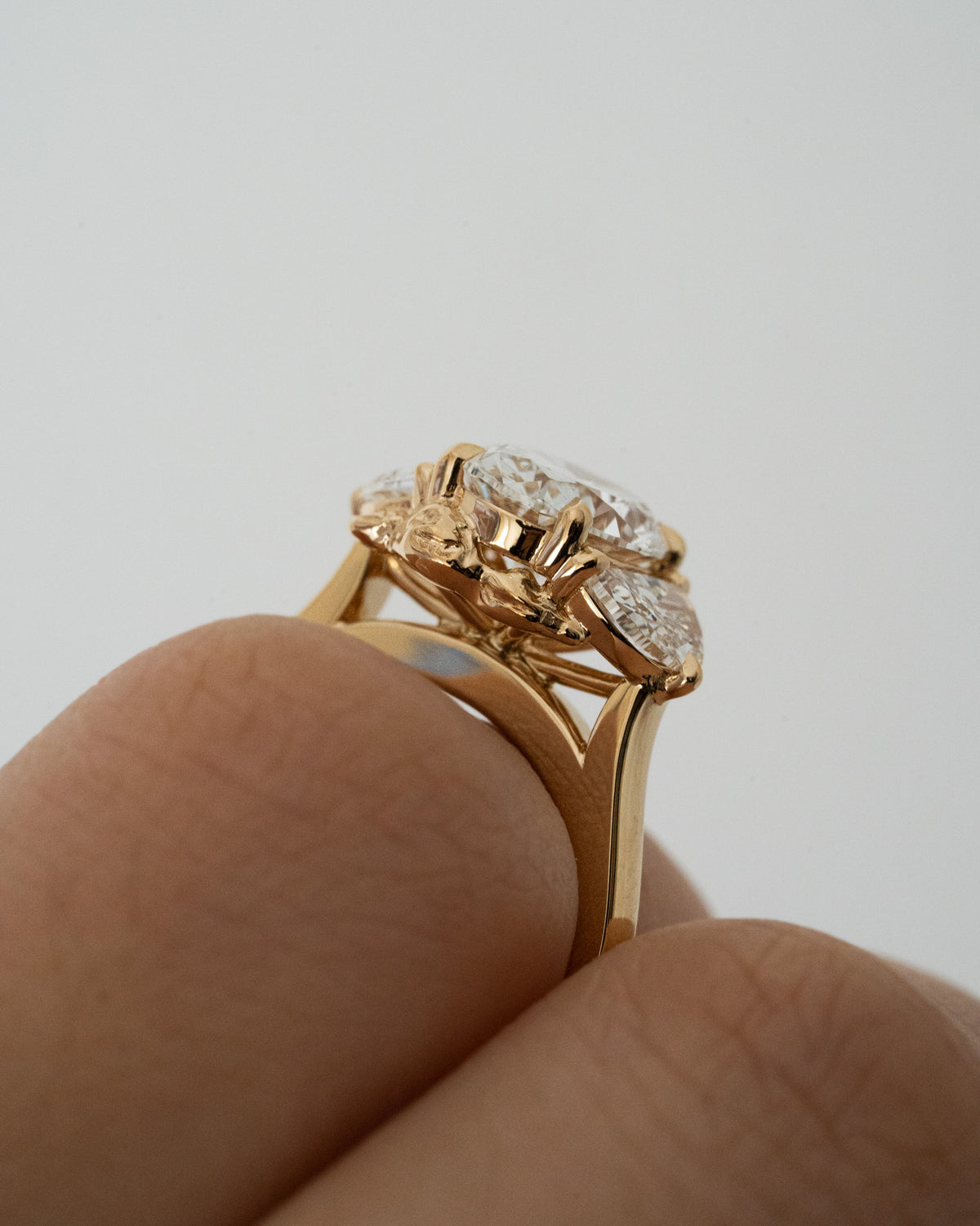 Oval diamond with half moon trilogy
