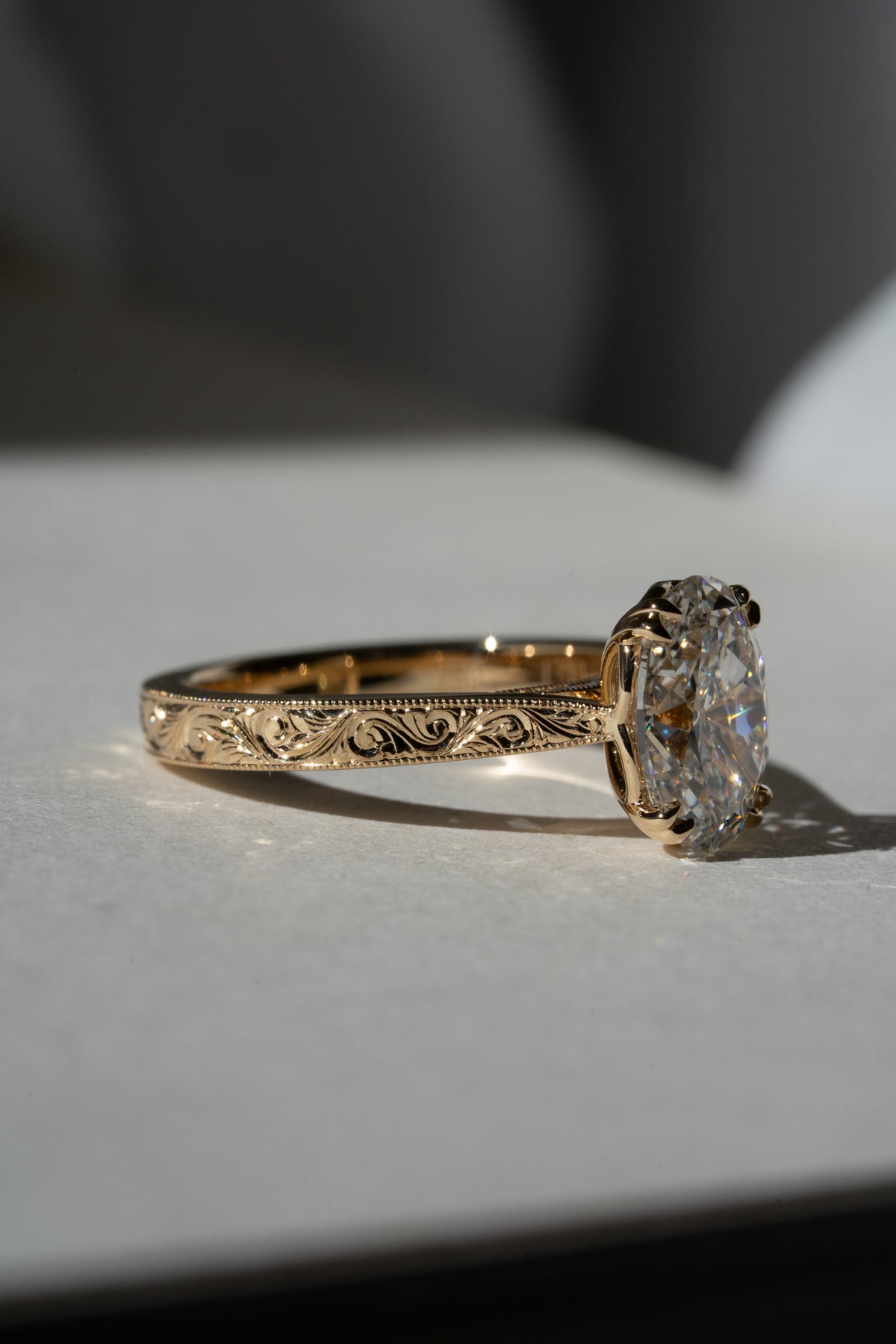 Old mine oval with hand-engraved scroll band