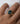 Top-down view of blue radiant cut diamond ring in 18k yellow gold showing trapezoid side stone setting detail
