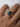 Top-down view of blue radiant cut diamond ring in 18k yellow gold showing trapezoid side stone setting detail