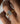 Close up o hand wearing a vintage engraved engagement ring